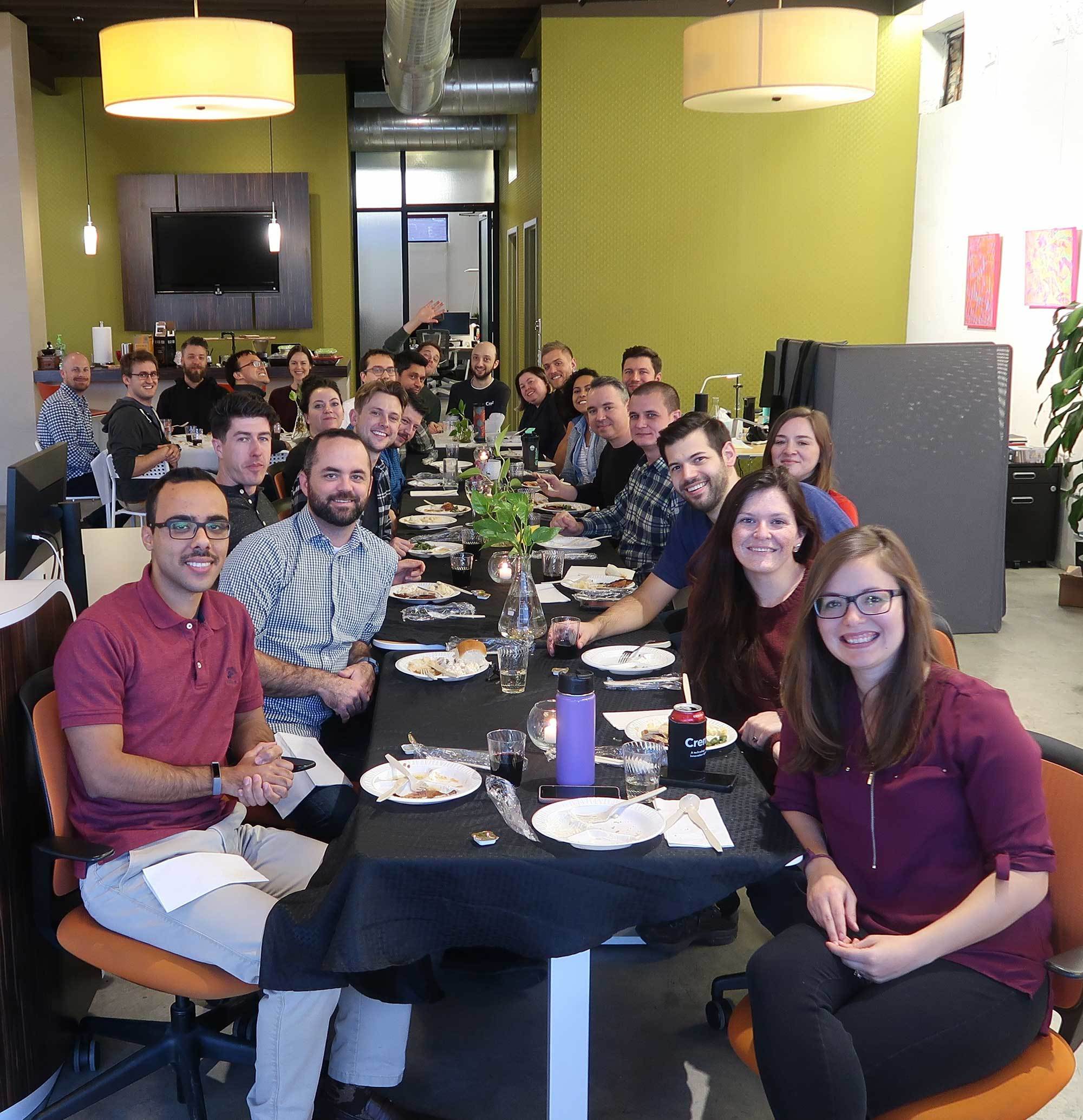 Photo of the Crema team having a meal together in the Crema office