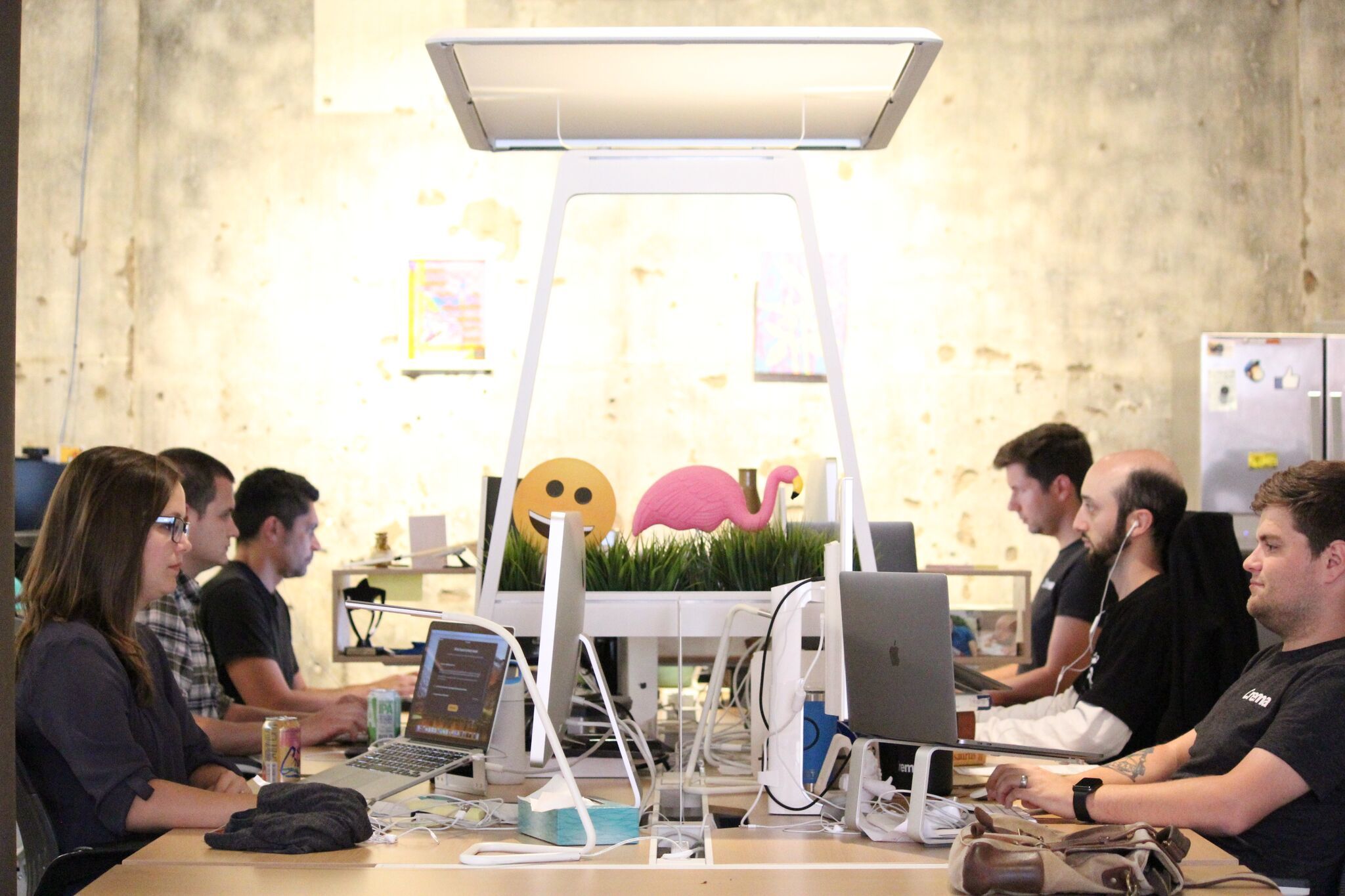 Photo of the team working together around a large table